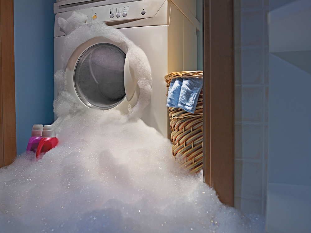 Soap coming out from a broken washing machine